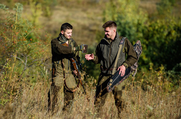 Army forces. Camouflage. Military uniform fashion. Friendship of men hunters. Hunting skills and...