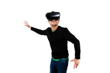 Bearded Young nice, modern and smile with vr glasses enjoying virtual reality with a simulator isolated on white background