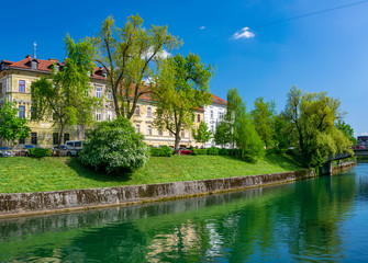 Obraz premium Scenic view of embankment of Ljubljanica river in Ljubljana, Slovenia