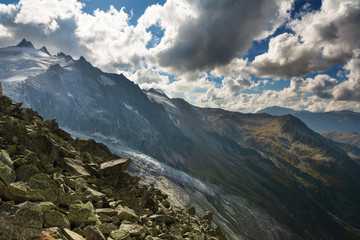 Fototapeta premium Landscape with Swiss alpine mountains with glaciers and sunset.