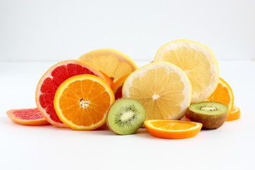 Layers of sliced fruits - kiwi, orange and grapefruits