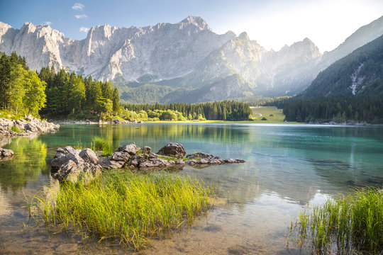 Superior Fusine Lake with Mount Mangart on the background. Fusine Lakes Natural Park, Tarvisio, Udine province, Friuli Venezia Giulia, Italy.