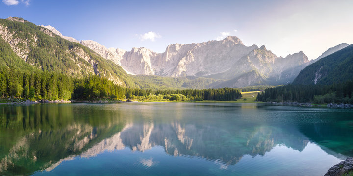 Superior Fusine Lake with Mount Mangart on the background. Fusine Lakes Natural Park, Tarvisio, Udine province, Friuli Venezia Giulia, Italy.