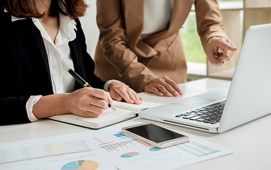 Hands of businessman giving coin to trees growing on coin and banknote. Business growth concept.