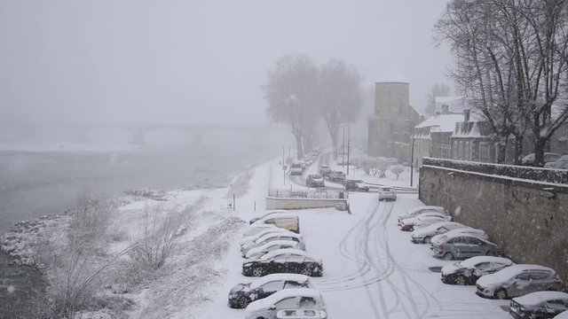 Winter cityscape: snowfall in the old French city