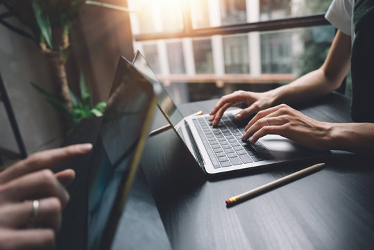 Woman Hands Typing On Laptop Keyboard At The Office