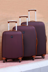 Close up trolly bag sets luggage  on texture background trolly bag.