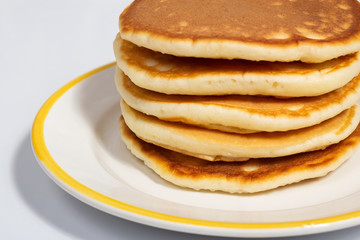 Pancakes on a white plate close up