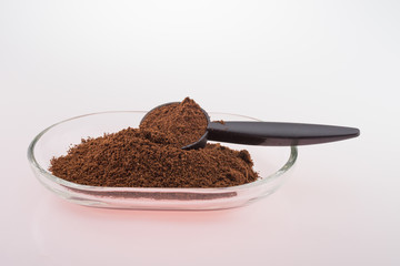 Ground coffee in glass bowl