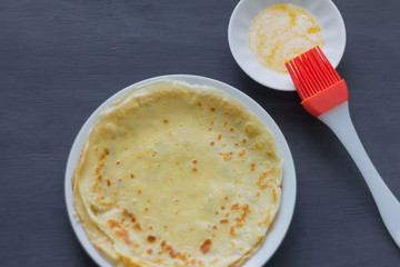 cooking pancakes, pancakes and butter on the table