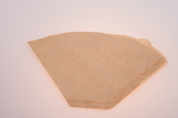 Ground coffee in filter isolated on white background