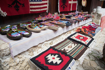 KRUJE, ALBANIA - June 2018: Traditional Ottoman market in Kruja, birth town of National Hero Skanderbeg. Flea market in Albania. Antique items and souvenirs for sale.