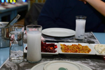 Turkish raki and appetizers close up view
