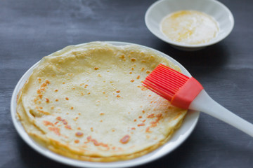 cooking pancakes, pancakes and butter on the table