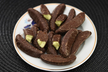 chocolate  bananas on porcelain plate