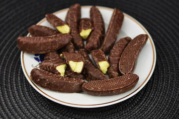 chocolate  bananas on porcelain plate
