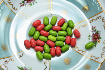 red, green,vitamin pills,candy,Drops