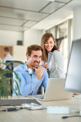 Two people in start up office, working together 