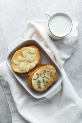 Homemade cat's tounge cookies with milk on marble background. Langues de chat.