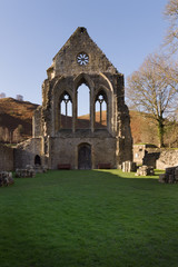 Fototapeta na wymiar Valle Crucis Abbey was founded in 1201 as a Cistercian monastery and closed in 1537. The ruins are a prominent landmark in the vale of Llangollen North Wales
