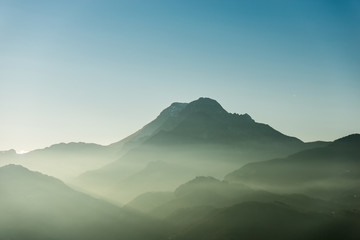 Naklejka premium Soft landscape with fog and mountain - Apuan Alps