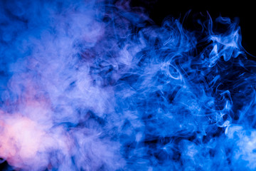 Fototapeta na wymiar Ice pattern of a rising pair of blue exhaled vape neon blue on a black background with curly streams of white smoke.