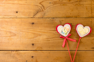 Red heart on wood.