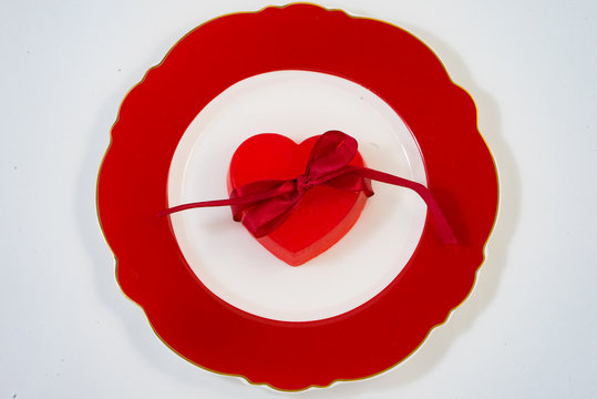 Red heart on a red plate.