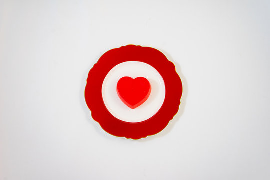Red heart on a red plate.
