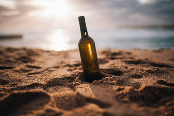 A bottle of white wine on the beach