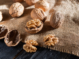 Fototapeta na wymiar useful walnuts closeup of purified nuclei and whole