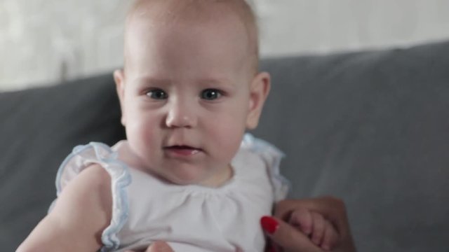 Baby looking into camera and laughing