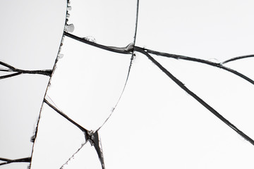 Crack and broken mirror in a front view image.