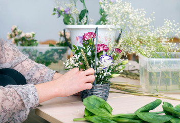 womens hands,  bouquet of flowers in a basket, a florist is a bouquet of flowers