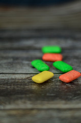 Orange, yellow and green chewing gum