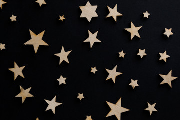 Wooden stars on a black background. Chalk board. Postcard. Dad's day concept. Men's Day. Night. Astronomy.