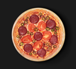 Isolated image of a Devil Pizza with tomatoes and jalapeno on a black background