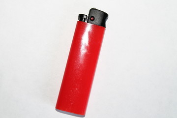 red lighter isolated on black background