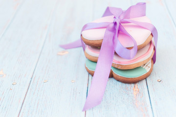 Pink gingerbread heart-shaped. Shabby chic style. On a light village background.