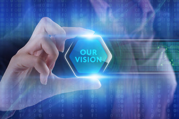 The concept of business, technology, the Internet and the network. A young entrepreneur working on a virtual screen of the future and sees the inscription: Our vision