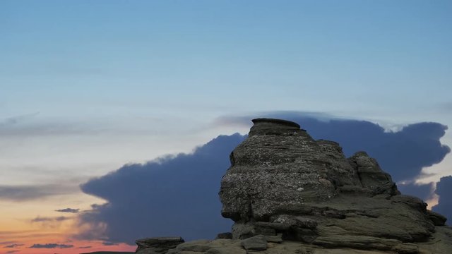 The Sphinx Rock (Sfinxul) in Bucegi Mountains Romania at sunset