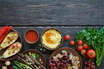 Dishes and snacks Middle Eastern or Arabic cuisine. Meat kebab, baked peppers and eggplants,...