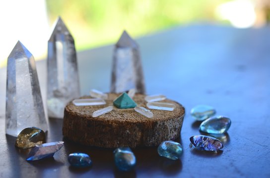 Beautiful, sparkling healing crystals. Witchy crystal grid, wiccan alter set up. Healing energy, shot in natural lighting with low exposure. Crystal Grid, sacred space. Bohemian decorations, romantic 
