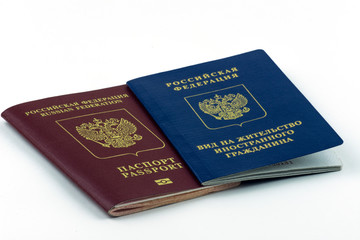Russian documents. Residence permit and russian passport on white background