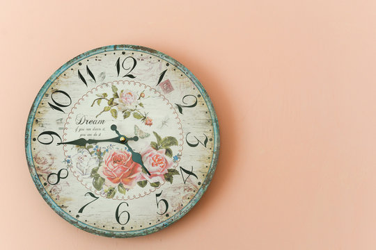 Wall clock on the pink wall