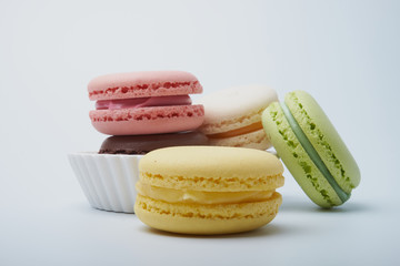 delicious dessert pastries French macaroons on white background