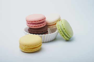 delicious dessert pastries French macaroons on white background