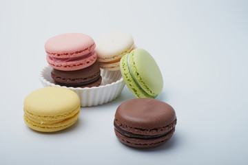 delicious dessert pastries French macaroons on white background