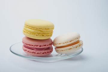delicious dessert pastries French macaroons on white background