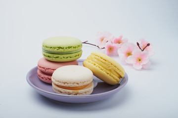 delicious dessert pastries French macaroons on white background